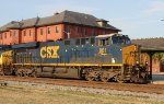 CSX 881 heads past the station